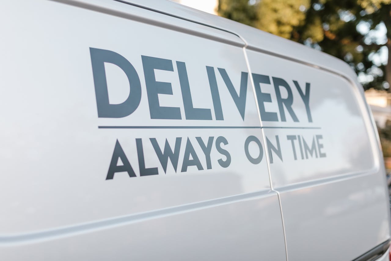 Close-up of delivery van with slogan 'Always On Time' emphasizing timely service.